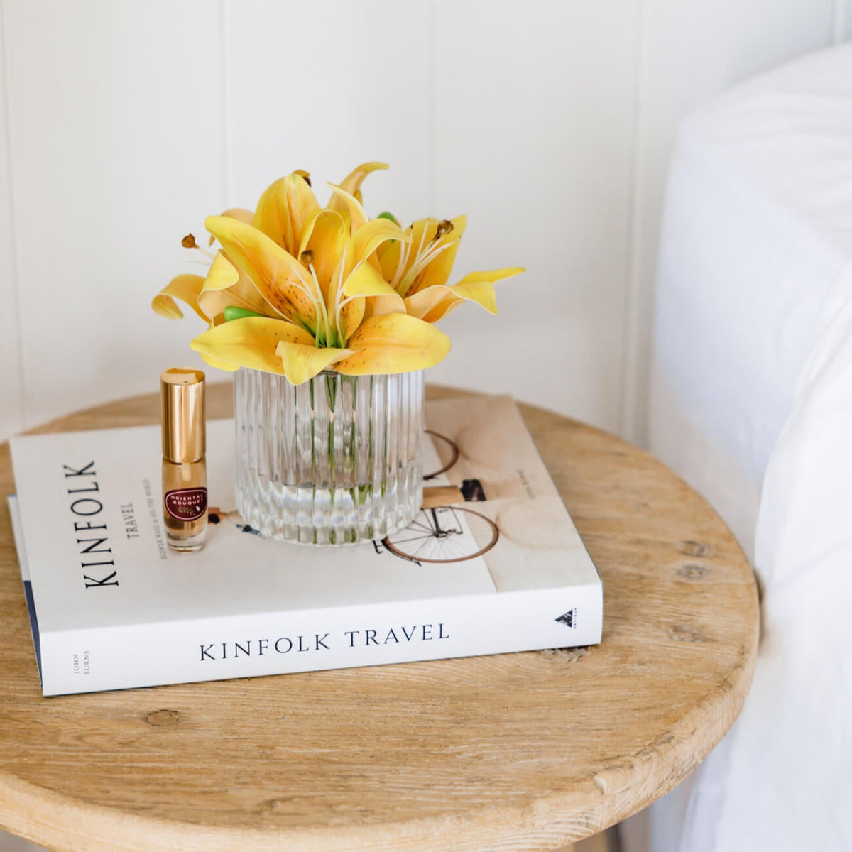 Yellow fake lily flowers in vase