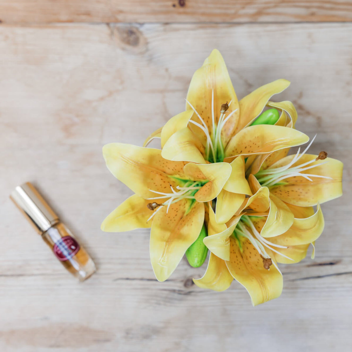 Artificial yellow lily flower arrangement with perfume spray