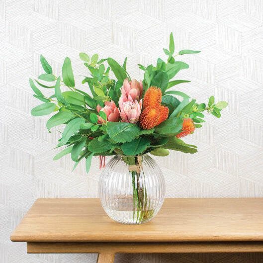 fake flower arrangement on a table