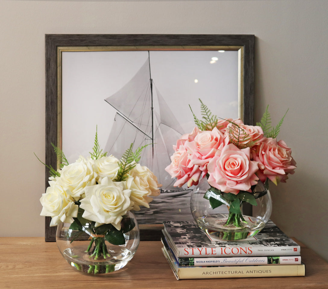pink and white faux rose arrangements positioned next to each other